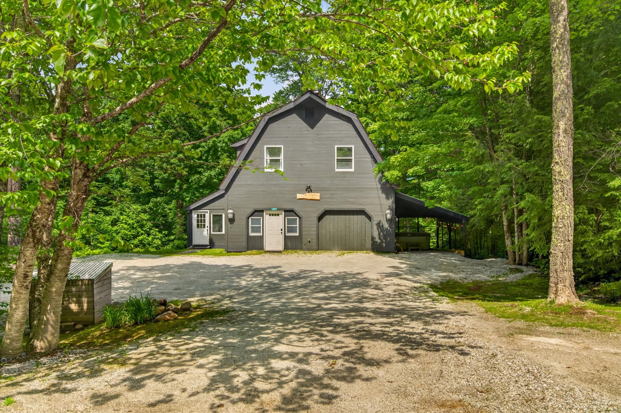 Slippery Slope Chalet front exterior with gambrel roof and gravel driveway — Killington Vermont