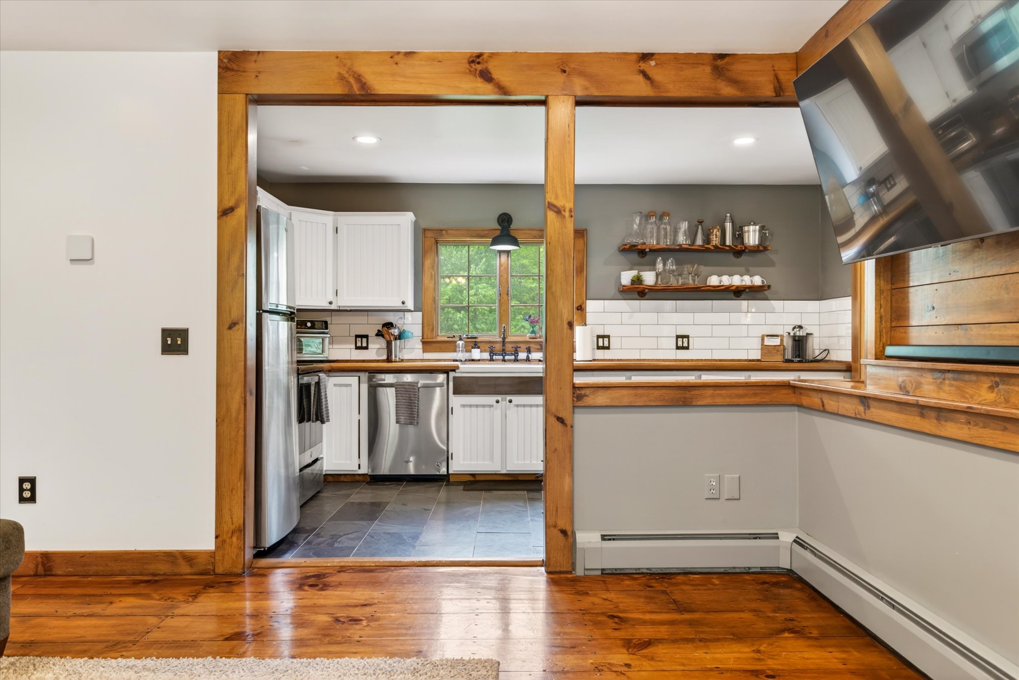 Gourmet kitchen with stainless appliances and open shelves — Slippery Slope Chalet