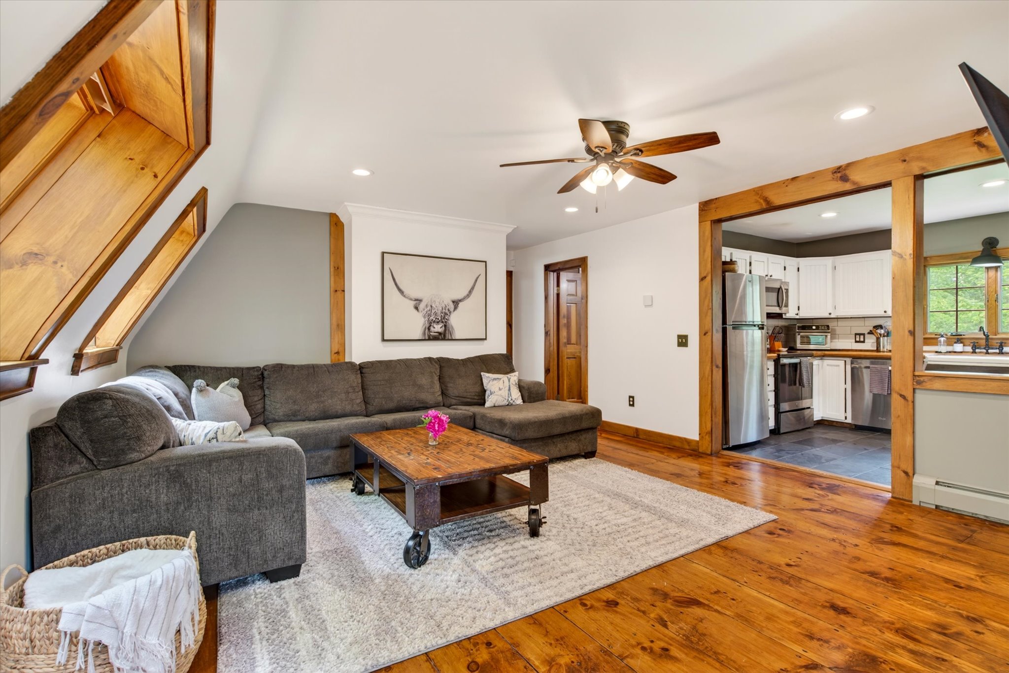 Lower living room open to kitchen — Slippery Slope Chalet